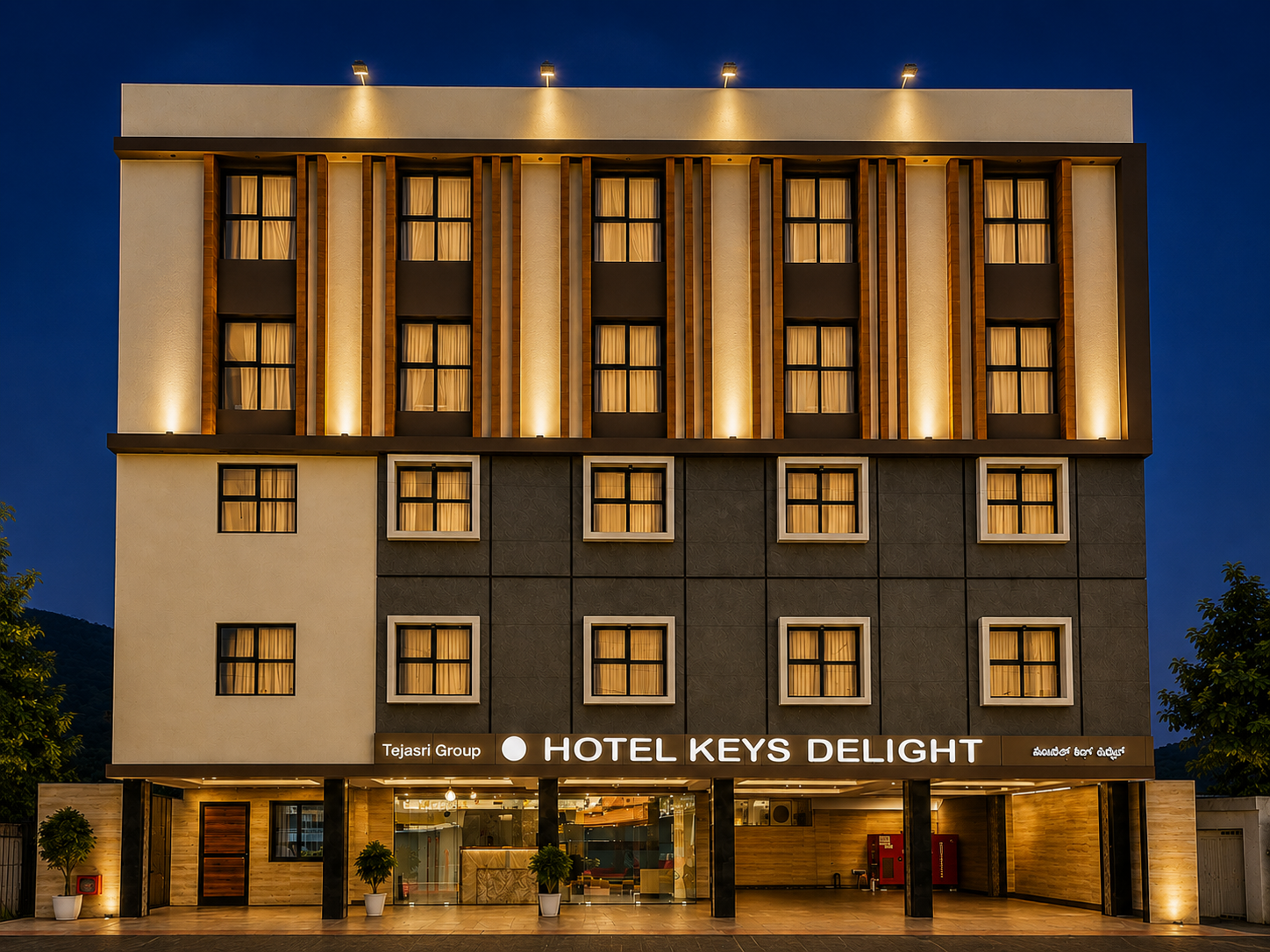 Hotel Keys Delight illuminated at dusk in Vijayawada